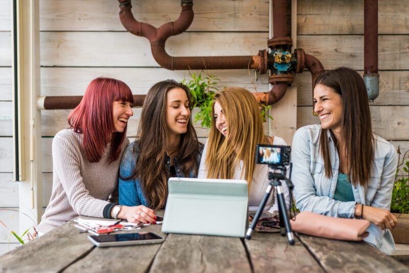 young women who are influencers are working on their digital storytelling