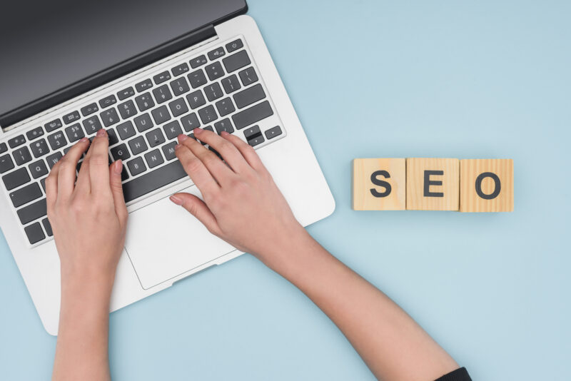 Search engine optimization, woman writing SEO strategy